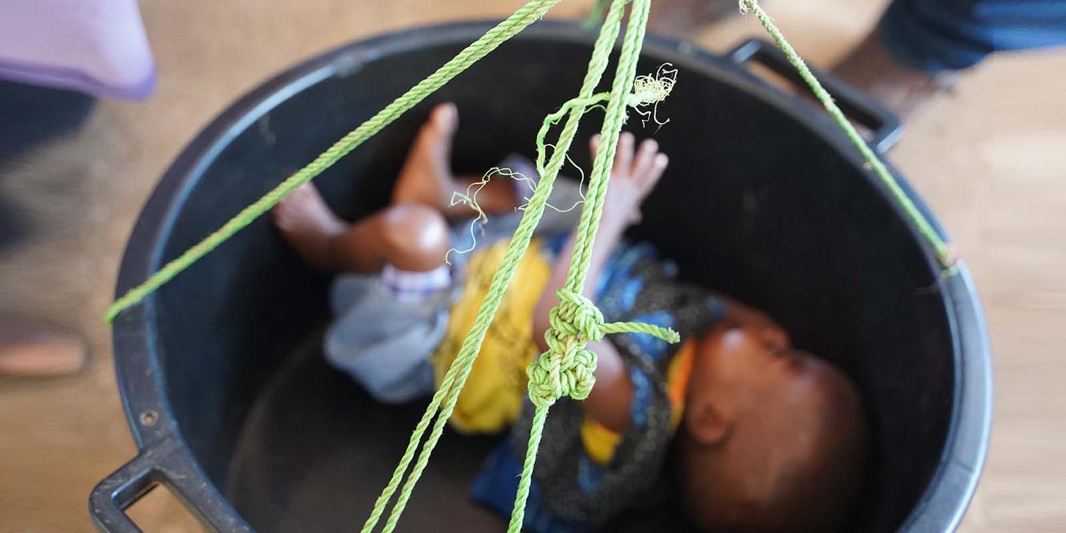 In Somalia, a baby is weighed and screened for malnutrition. In Somalia, a baby is weighed and screened for malnutrition.