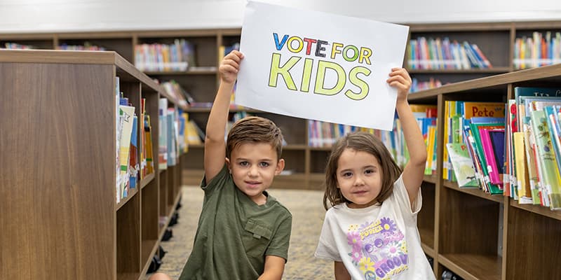 5-year-olds Lucas, left and Oaklynn, right, in their elementary school library on September 25, 2024 in South Carolina