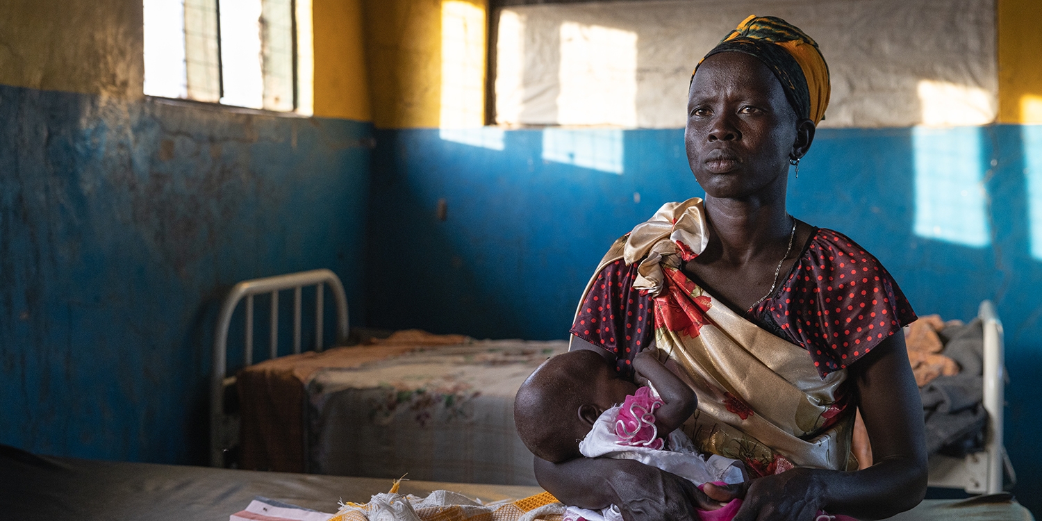 South Sudan. a mother holds her baby in a Save the Children stabilization center South Sudan. a mother holds her baby in a Save the Children stabilization center