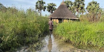 South Sudan, a child stands in the middle of receding flood waters South Sudan, a child stands in the middle of receding flood waters