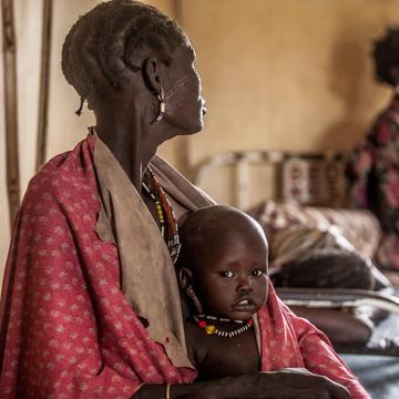 One year-old Hakaroom sits with his mother Lokuru at a Save the Children supported health centre in Kapoeta, South Sudan, after being treated for severe pneumonia. One year-old Hakaroom sits with his mother Lokuru at a Save the Children supported health centre in Kapoeta, South Sudan, after being treated for severe pneumonia.