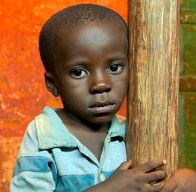 Portrait of a young pre-school boy, age three, in Tanzania. This young child grandmother hopes he will one day be able to attend school and break the cycle of poverty in which he’s grown up. Photo Credit: Colin Crowley/Save the Children, December 2010. Portrait of a young pre-school boy, age three, in Tanzania. This young child grandmother hopes he will one day be able to attend school and break the cycle of poverty in which he’s grown up. Photo Credit: Colin Crowley/Save the Children, December 2010.