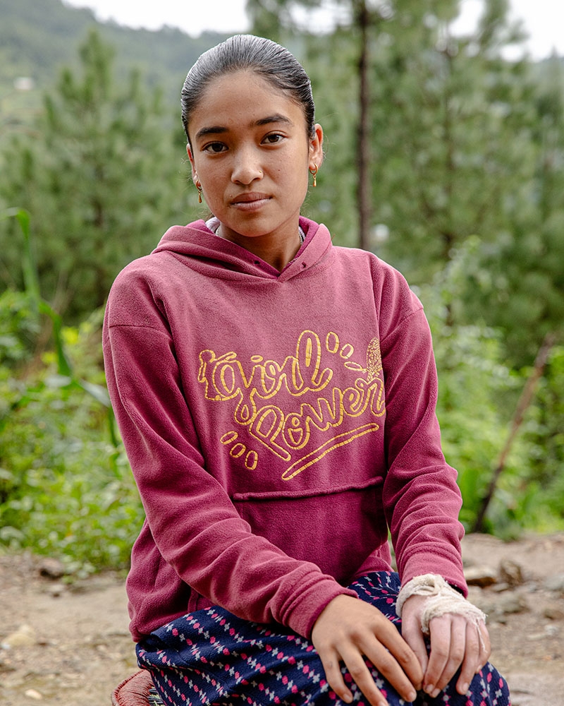 A teenage girl in Nepal sits for a portrait A teenage girl in Nepal sits for a portrait