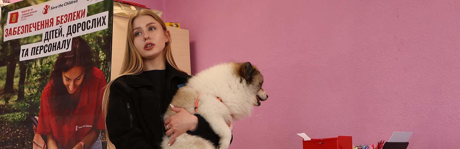 Mine detection dog teaching children landmine safety in Ukraine classroom