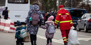 Ukraine refugees, including children, arriving in Romania receive humanitarian aid. Ukraine refugees, including children, arriving in Romania receive humanitarian aid.