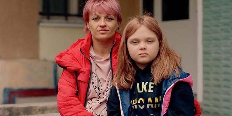 A mother and daughter who have been displaced due to the war in Ukraine sit together. A mother and daughter who have been displaced due to the war in Ukraine sit together.