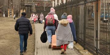 Ukrainian refugees, including children, arrive in Romania wearing coats, hats and blankets to receive humanitarian aid. Ukrainian refugees, including children, arrive in Romania wearing coats, hats and blankets to receive humanitarian aid.