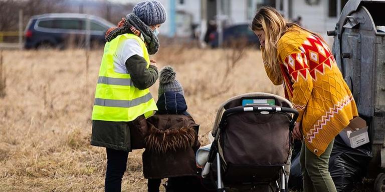 Ukrainian families and children crossing the border into Romania to escape conflict. Ukrainian families and children crossing the border into Romania to escape conflict.