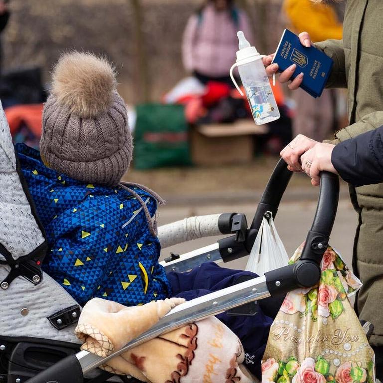Ukrainian mothers and children crossing the border into Romania to escape conflict. Ukrainian mothers and children crossing the border into Romania to escape conflict.