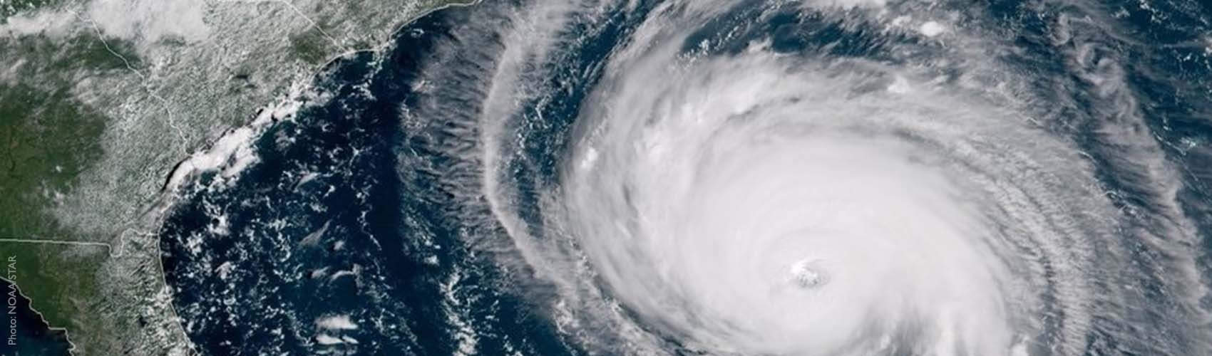 A large hurricane on a weather map moving towards East Coast of the United States.