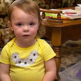 An 18-month old girl stares at the camera during an Early Steps home visit in Kentucky An 18-month old girl stares at the camera during an Early Steps home visit in Kentucky