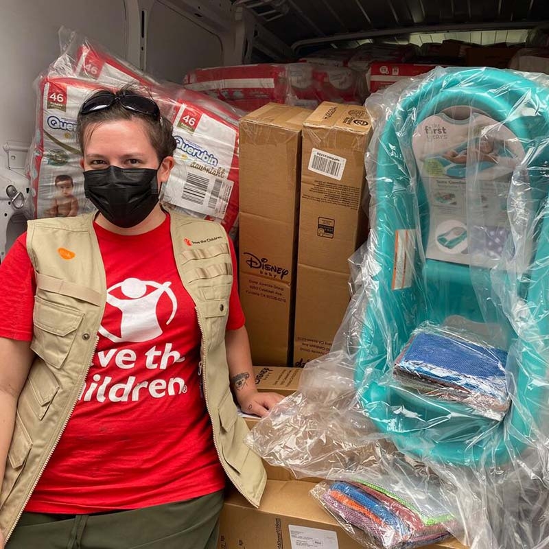 A Save the Children team member stands next to a truck filled with supplies to help children and families impacted by Hurricane Ian in Florida. A Save the Children team member stands next to a truck filled with supplies to help children and families impacted by Hurricane Ian in Florida.