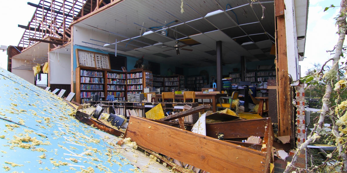 Destruction from Hurricane Michael, 2018, which hit the Florida panhandle and devastated nearby communities in Florida, Georgia and the Carolinas. This photo depicts The Kinard Branch Library in Wewahitchka that sustained detrimental damage. Photo credit: Gordon Folkes, Save the Children. October 2018.