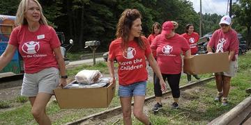 Save the Children staffers carry supplies to families impacted by the Kentucky Floods. Save the Children staffers carry supplies to families impacted by the Kentucky Floods.