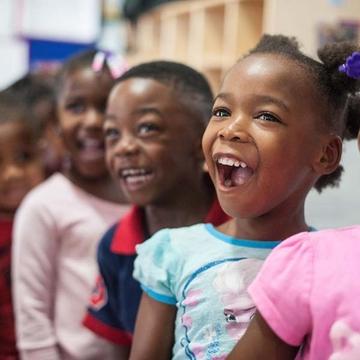 Children smiling in the classroom Children smiling in the classroom