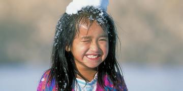 A girl plays outside in the snow A girl plays outside in the snow