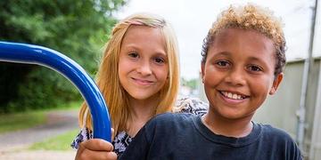 Two children play outside Two children play outside