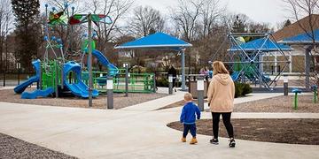 Parents and children enjoy a well-equipped playground in Putnam County, West Virginia. Parents and children enjoy a well-equipped playground in Putnam County, West Virginia.