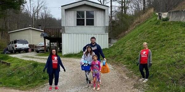 While practicing compassionate social distancing, Save the Children staff provide food to a family in rural Kentucky as the coronavirus pandemic continues to impact families across America.