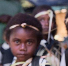 A five-year old schoolgirl, wears her new school bag with pride. 3 months after a cyclone devastated her school on the island of Tongoa, her school reopened and she was able to return to Kindergarten. The community rebuilt the structure from scavenged wood and bricks; Save the Children provided tarpaulins, books, toys and games – plus a new school bag, presented to each child on their first day back. A five-year old schoolgirl, wears her new school bag with pride. 3 months after a cyclone devastated her school on the island of Tongoa, her school reopened and she was able to return to Kindergarten. The community rebuilt the structure from scavenged wood and bricks; Save the Children provided tarpaulins, books, toys and games – plus a new school bag, presented to each child on their first day back.