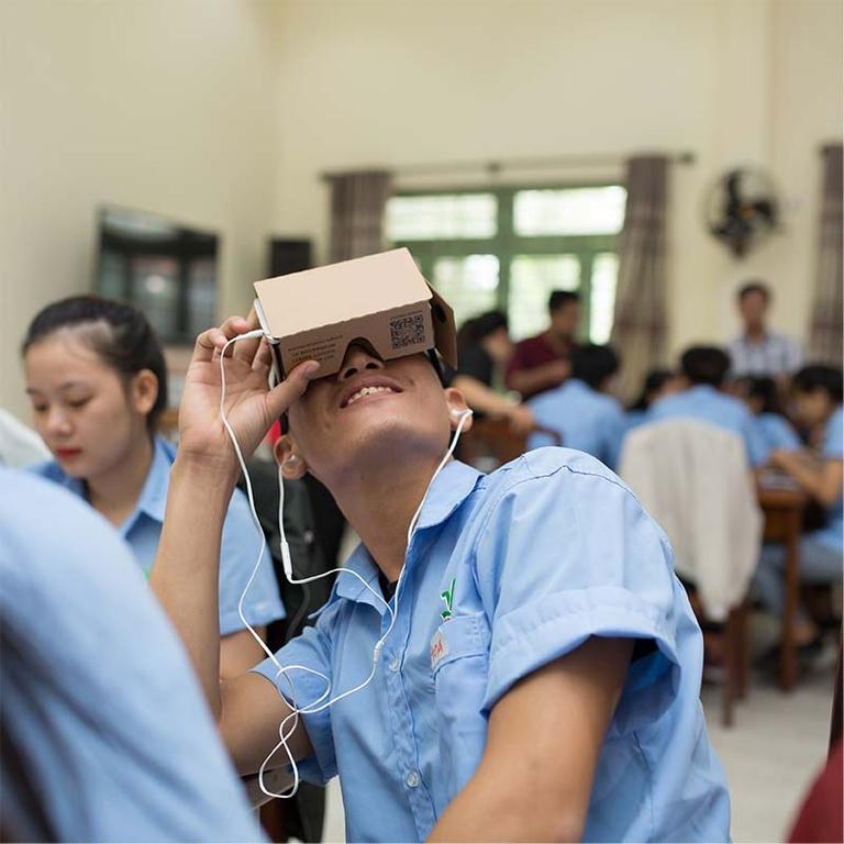 Student experiences VR device on August 24, 2018 in Danang, Vietnam. Photo credit: Roi Images/STUDIO at Getty Images for Accenture 2018. Student experiences VR device on August 24, 2018 in Danang, Vietnam. Photo credit: Roi Images/STUDIO at Getty Images for Accenture 2018.