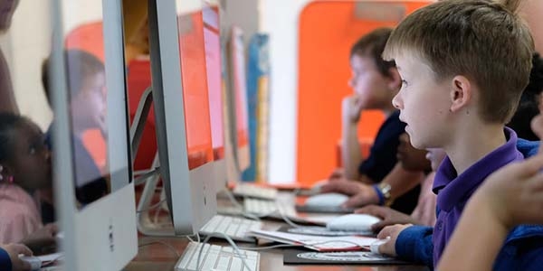 USA, a students sit, working at computers USA, a students sit, working at computers