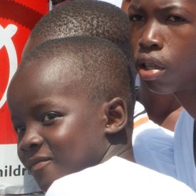 In Guinea, children, whose schools are currently closed due to Ebola, prepare messaging in their local dialects, for a television broadcast to spread the message about the importance of washing hands regularly with soap. Photo credit: Save the Children, October 2014.