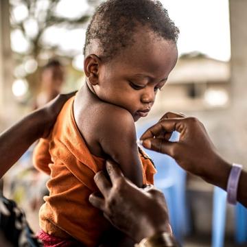 A one-year-old child prepares to receive his Yellow Fever vaccination in the Democratic Republic of Congo. A one-year-old child prepares to receive his Yellow Fever vaccination in the Democratic Republic of Congo.
