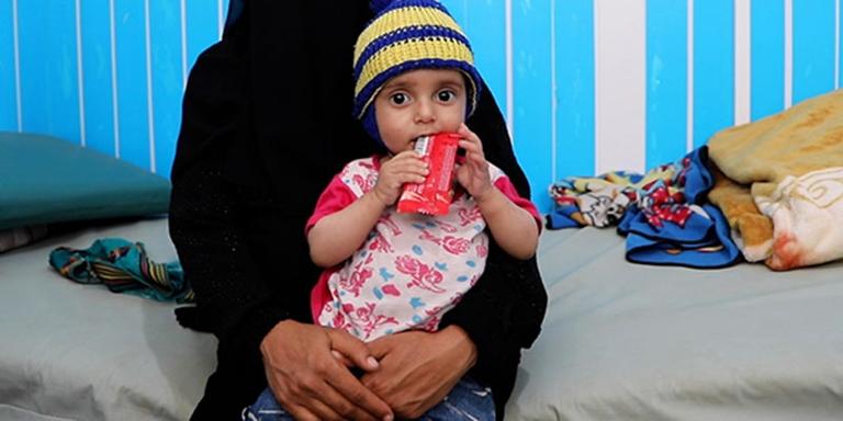 In Yemen, a young child receives treatment for malnutrition at a health center where children facing starvation are seen. In Yemen, a young child receives treatment for malnutrition at a health center where children facing starvation are seen.